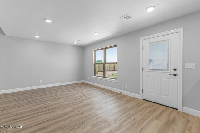 1224 Sheila Ann Dr, Carthage, MO 64836 - entryway with light wood-type flooring and recessed lighting