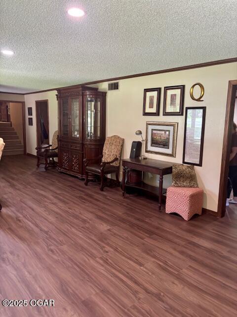 1606 Fairview Ave, Baxter Springs, KS 66713 - sitting room with a textured ceiling, stairs, wood finished floors, and crown molding