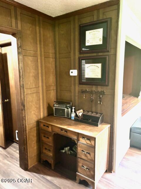 1606 Fairview Ave, Baxter Springs, KS 66713 - bar with light wood-type flooring and a textured ceiling