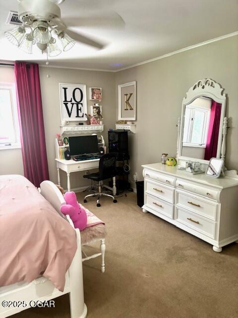 1606 Fairview Ave, Baxter Springs, KS 66713 - carpeted bedroom featuring crown molding and ceiling fan