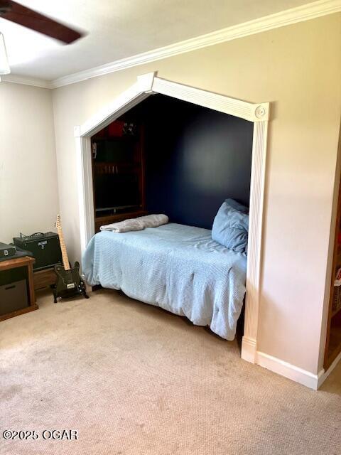 1606 Fairview Ave, Baxter Springs, KS 66713 - carpeted bedroom with crown molding and ceiling fan