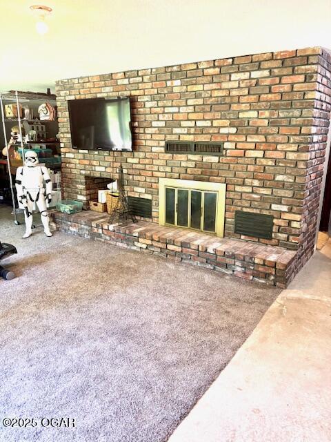 1606 Fairview Ave, Baxter Springs, KS 66713 - unfurnished living room with a brick fireplace