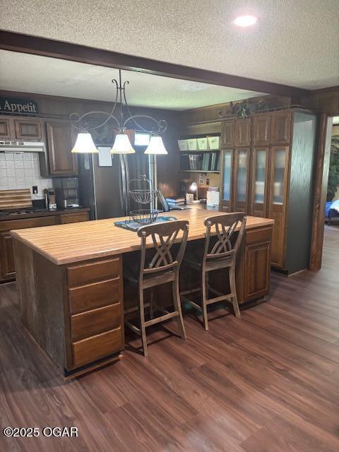 1606 Fairview Ave, Baxter Springs, KS 66713 - kitchen with wood counters, a textured ceiling, stainless steel refrigerator with ice dispenser, dark wood-style floors, and a kitchen island