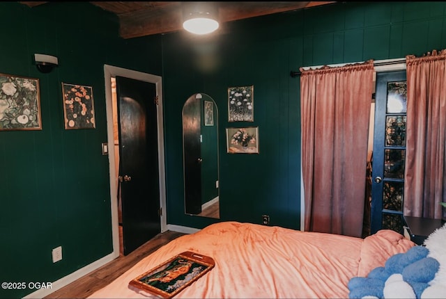 706 S Broadview Dr, Springfield, MO 65809 - bedroom with wood finished floors and arched walkways