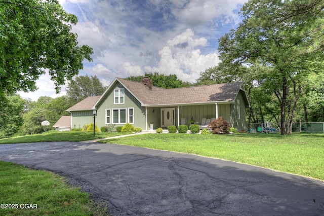 204 Split Rail Dr, Joplin, MO 64801 - view of front of property with a chimney, board and batten siding, and roof with shingles