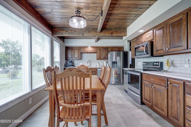 204 Split Rail Dr, Joplin, MO 64801 - dining space featuring healthy amount of natural light and a wood ceiling with exposed beams