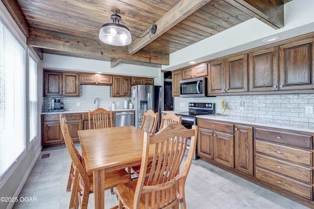 204 Split Rail Dr, Joplin, MO 64801 - dining space with a wooden ceiling with exposed beams and light tile patterned floors