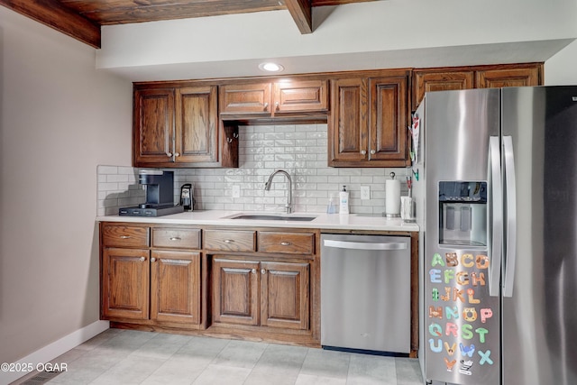 204 Split Rail Dr, Joplin, MO 64801 - kitchen with stainless steel appliances, light countertops, backsplash, brown cabinets, and recessed lighting