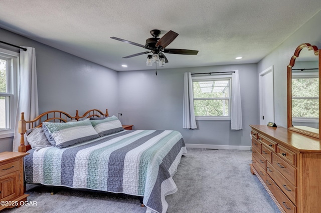 204 Split Rail Dr, Joplin, MO 64801 - bedroom with multiple windows, light colored carpet, a textured ceiling, ceiling fan, and recessed lighting