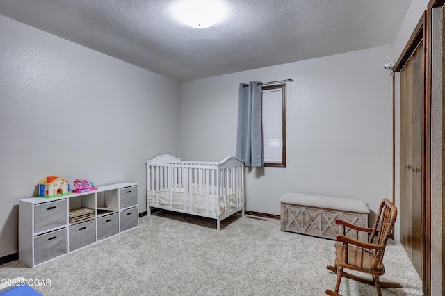 204 Split Rail Dr, Joplin, MO 64801 - carpeted bedroom with a textured ceiling and a nursery area