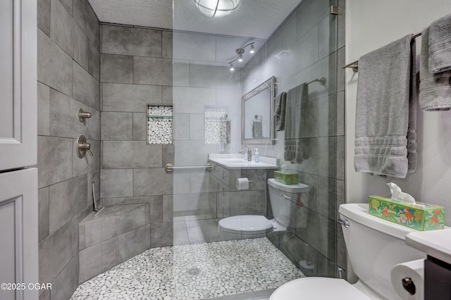 204 Split Rail Dr, Joplin, MO 64801 - full bathroom with a tile shower, vanity, and a textured ceiling