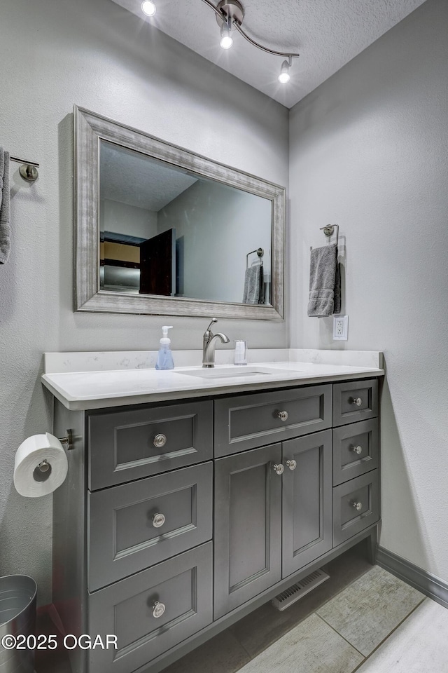 204 Split Rail Dr, Joplin, MO 64801 - bathroom featuring vanity, tile patterned floors, and a textured ceiling