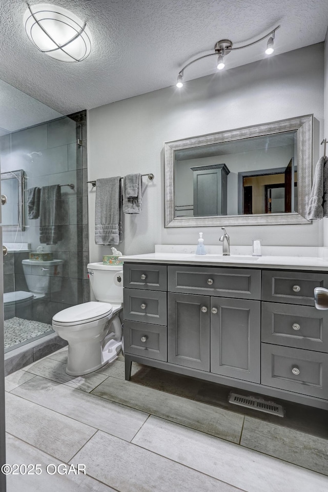 204 Split Rail Dr, Joplin, MO 64801 - full bath with a tile shower, vanity, and a textured ceiling