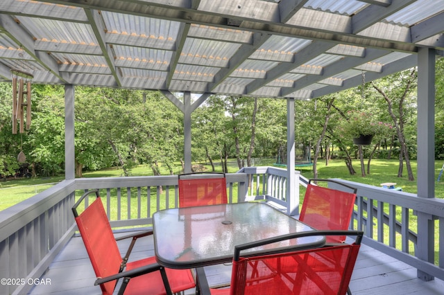 204 Split Rail Dr, Joplin, MO 64801 - wooden terrace featuring outdoor dining space, a pergola, a lawn, and view of wooded area