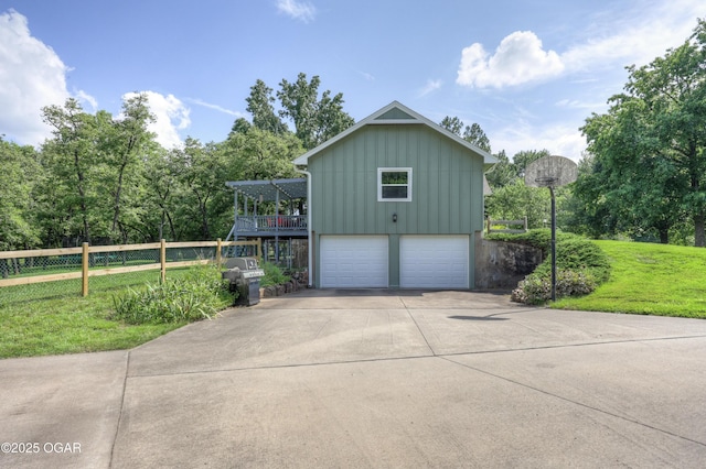 204 Split Rail Dr, Joplin, MO 64801 - view of side of home with board and batten siding, an attached garage, and concrete driveway