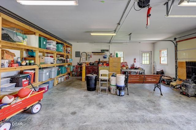 204 Split Rail Dr, Joplin, MO 64801 - garage with a workshop area and a garage door opener