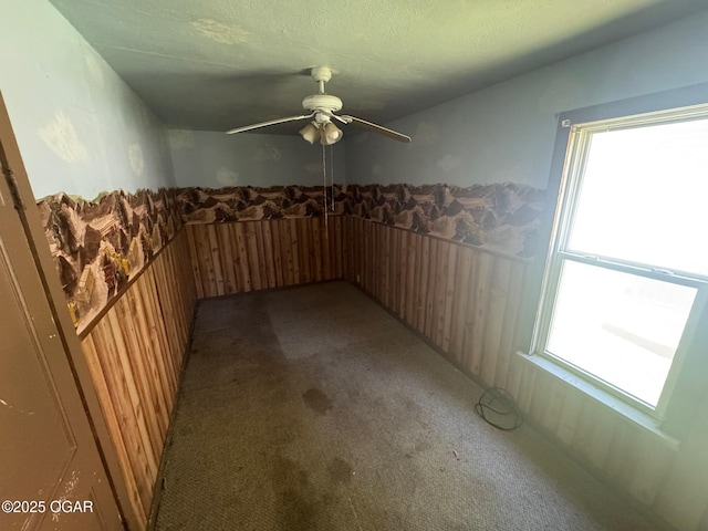 416 E 4th St, Baxter Springs, KS 66713 - carpeted empty room featuring a ceiling fan and plenty of natural light