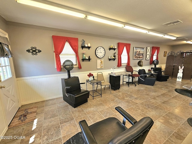 310 W 19th St, Baxter Springs, KS 66713 - common area featuring wainscoting and a textured ceiling