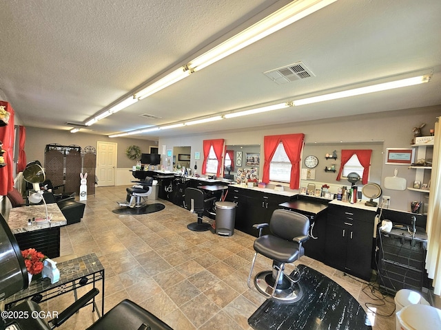 310 W 19th St, Baxter Springs, KS 66713 - misc room with a textured ceiling