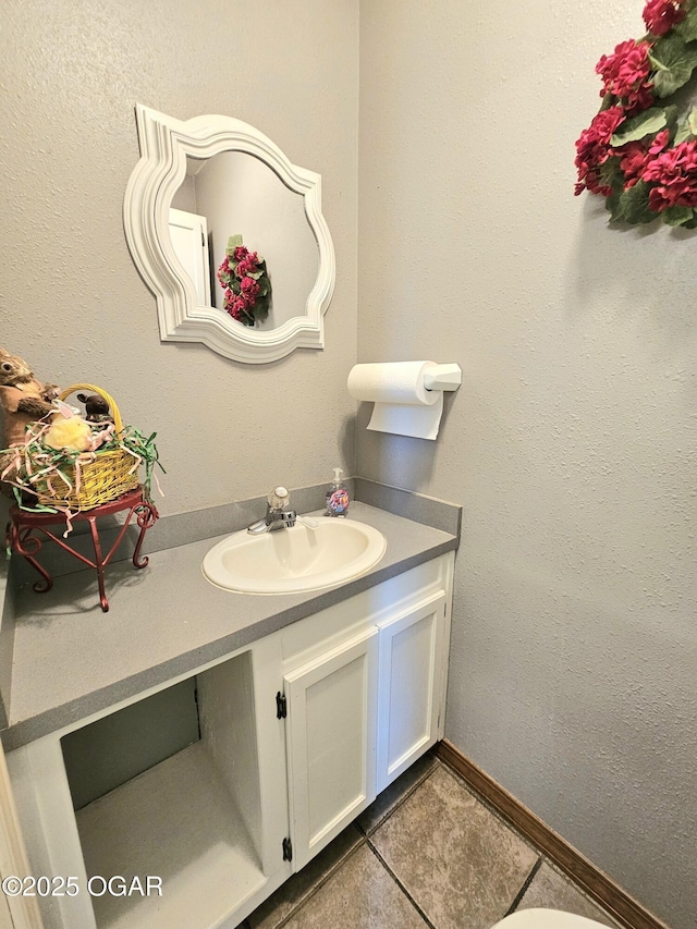 310 W 19th St, Baxter Springs, KS 66713 - bathroom with vanity and tile patterned flooring