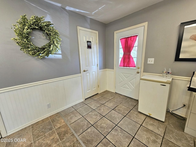 310 W 19th St, Baxter Springs, KS 66713 - entrance foyer featuring a wainscoted wall