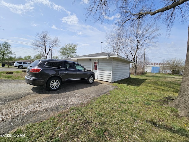 310 W 19th St, Baxter Springs, KS 66713 - view of home's exterior with a lawn and driveway