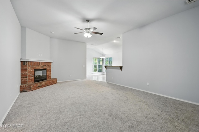 305 Anita Dr, Carl Junction, MO 64834 - unfurnished living room featuring vaulted ceiling, a fireplace, ceiling fan, and carpet flooring