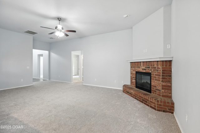 305 Anita Dr, Carl Junction, MO 64834 - unfurnished living room with ceiling fan, carpet, and a brick fireplace