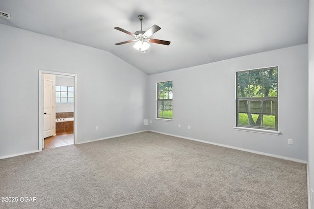 305 Anita Dr, Carl Junction, MO 64834 - empty room featuring carpet floors, plenty of natural light, vaulted ceiling, and a ceiling fan