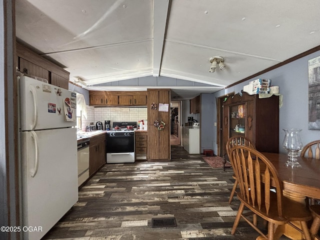 7575AND 7627 Amarillo Ln, Seneca, MO 64865 - kitchen with white appliances, dark wood-style flooring, washer / dryer, tasteful backsplash, and light countertops