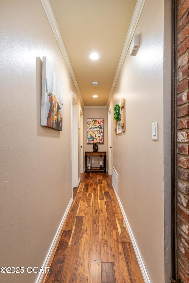 3101 Shore Dr, Grove, OK 74344 - hall with dark wood-style flooring, ornamental molding, and recessed lighting