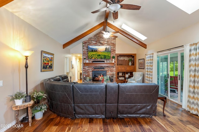 3101 Shore Dr, Grove, OK 74344 - living area featuring a ceiling fan, a skylight, beam ceiling, wood finished floors, and a fireplace