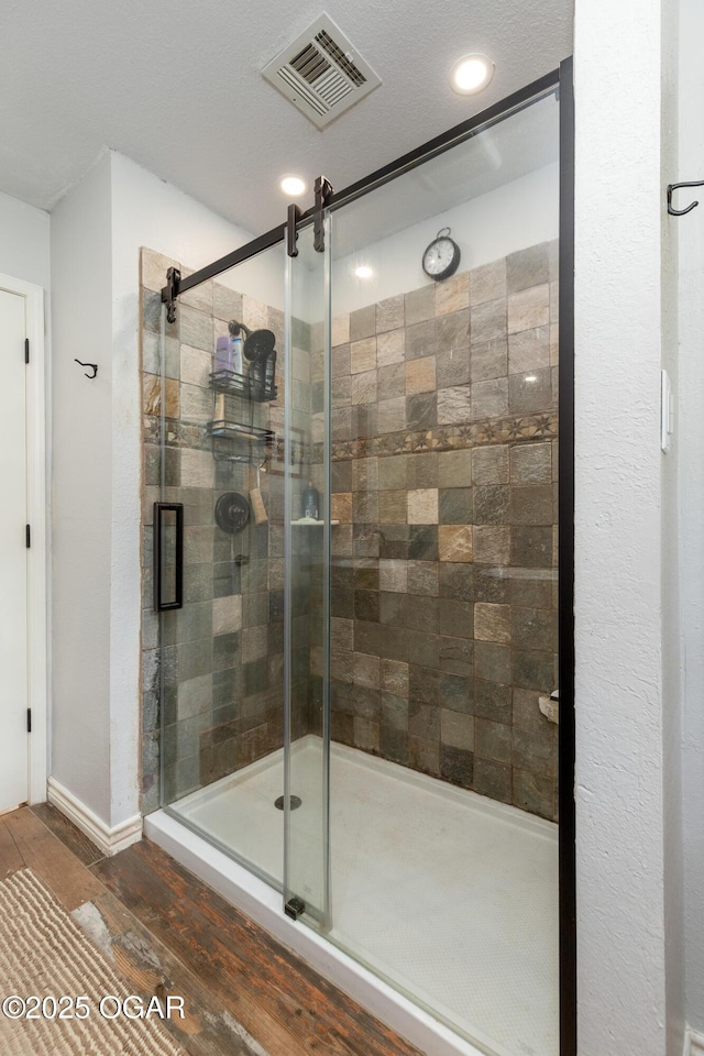 3101 Shore Dr, Grove, OK 74344 - bathroom with wood finished floors, a shower stall, and recessed lighting