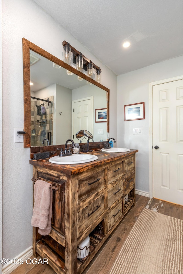 3101 Shore Dr, Grove, OK 74344 - full bath featuring double vanity, wood finished floors, and a stall shower