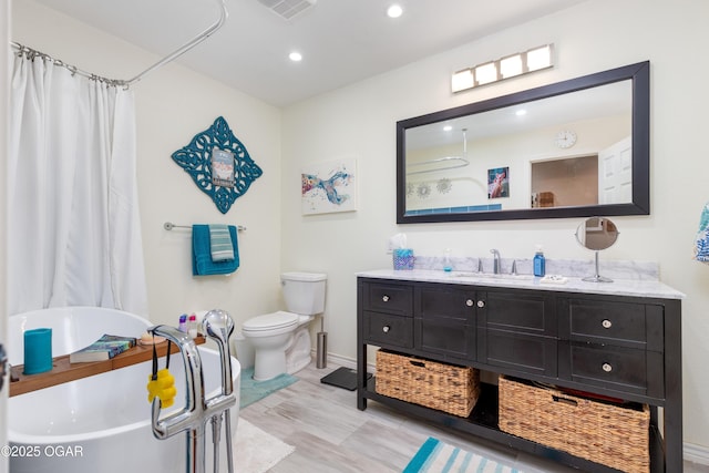 3101 Shore Dr, Grove, OK 74344 - bathroom featuring vanity, a freestanding tub, recessed lighting, and a shower with shower curtain