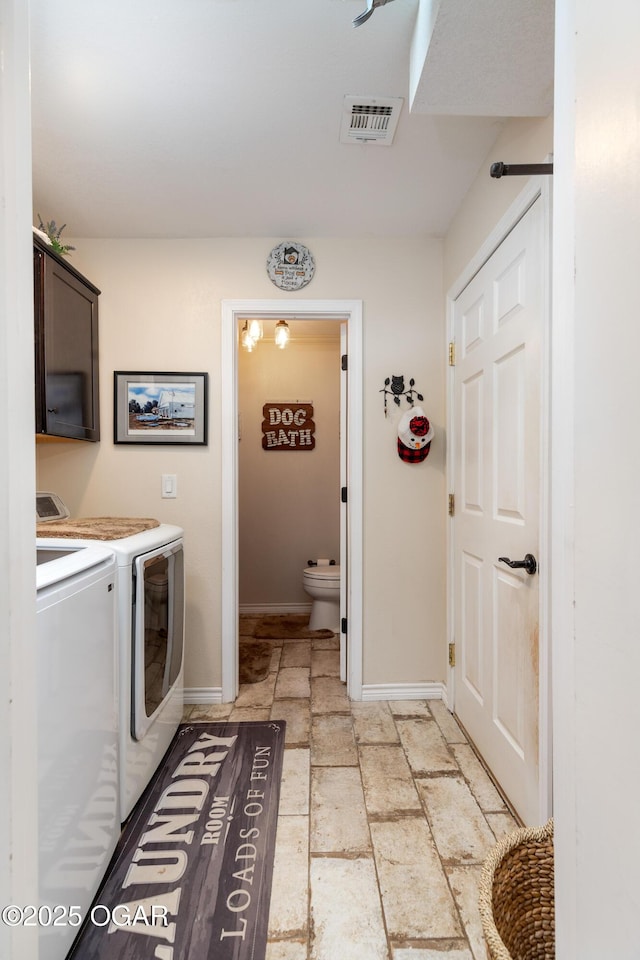 3101 Shore Dr, Grove, OK 74344 - washroom with washer and clothes dryer, cabinet space, and stone tile floors