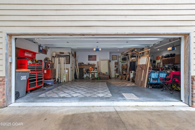 3101 Shore Dr, Grove, OK 74344 - garage featuring driveway and a garage door opener