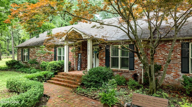 3101 Shore Dr, Grove, OK 74344 - view of front of house featuring brick siding and a shingled roof
