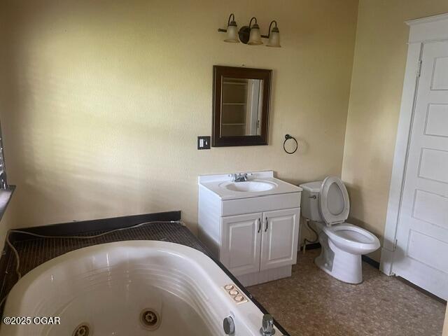 530 N Pearl Ave, Joplin, MO 64801 - full bathroom with a jetted tub and vanity