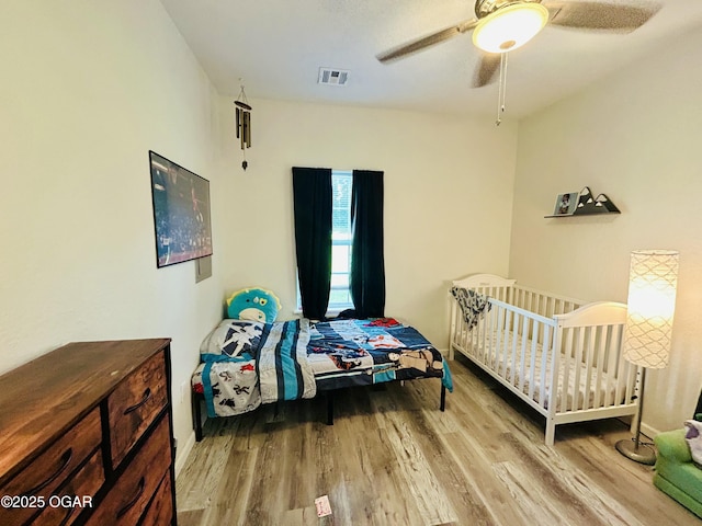 312 N Mineral Ave, Joplin, MO 64801 - bedroom featuring wood finished floors and ceiling fan