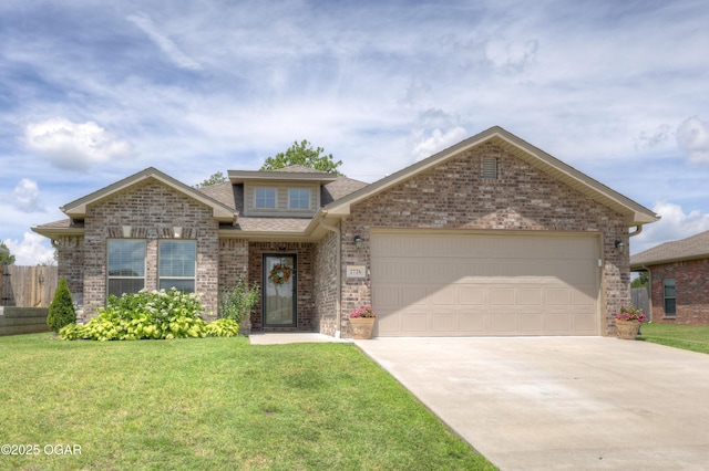 2726 S Lois Ln, Joplin, MO 64804 - view of front of house with driveway, brick siding, a garage, and roof with shingles