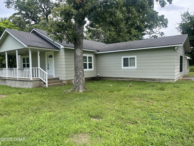 1701 S Kenser Rd, Joplin, MO 64801 - view of front of property with covered porch, a front lawn, and roof with shingles