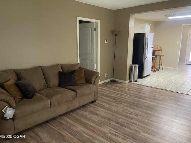 1701 S Kenser Rd, Joplin, MO 64801 - living area with light wood-type flooring and baseboards