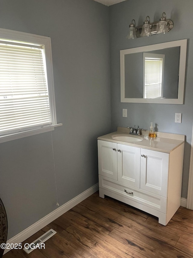 1701 S Kenser Rd, Joplin, MO 64801 - bathroom with vanity and wood finished floors