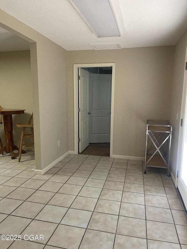 1701 S Kenser Rd, Joplin, MO 64801 - empty room with baseboards and light tile patterned flooring
