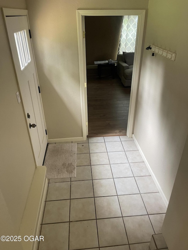 1701 S Kenser Rd, Joplin, MO 64801 - hallway with baseboards and light tile patterned flooring