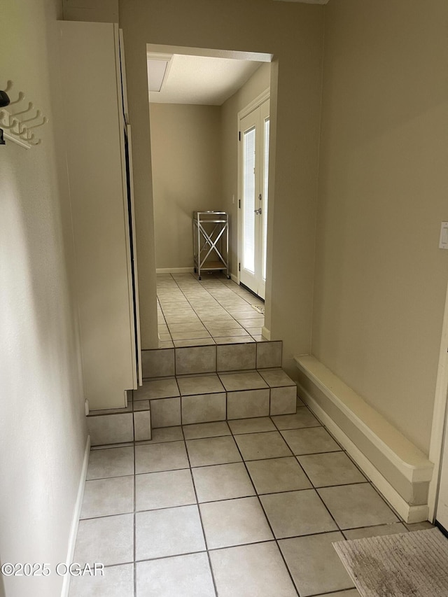 1701 S Kenser Rd, Joplin, MO 64801 - hallway featuring light tile patterned floors and french doors