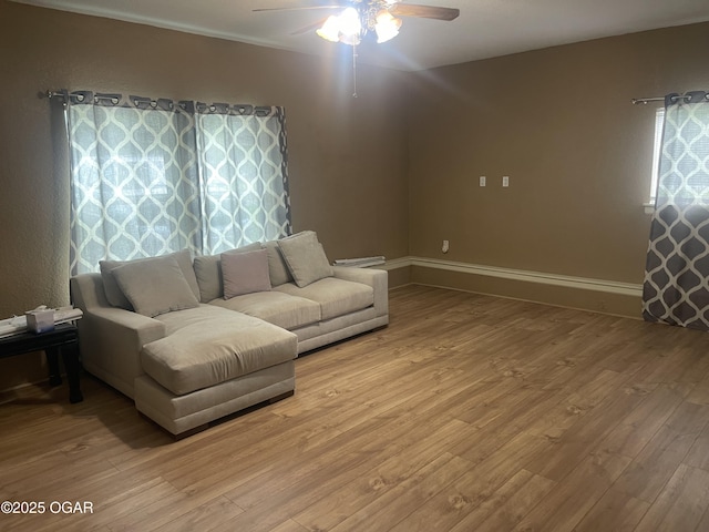 1701 S Kenser Rd, Joplin, MO 64801 - living area with a ceiling fan and light wood finished floors