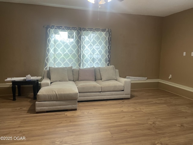 1701 S Kenser Rd, Joplin, MO 64801 - living room featuring wood finished floors and a ceiling fan