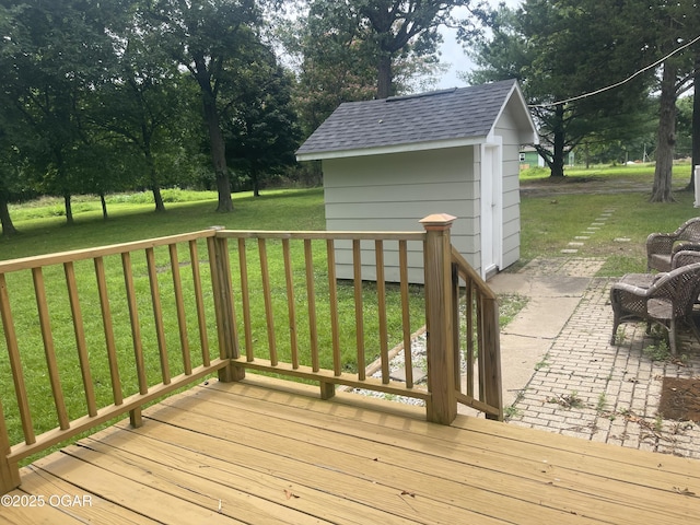 1701 S Kenser Rd, Joplin, MO 64801 - deck with a lawn, an outbuilding, and a patio